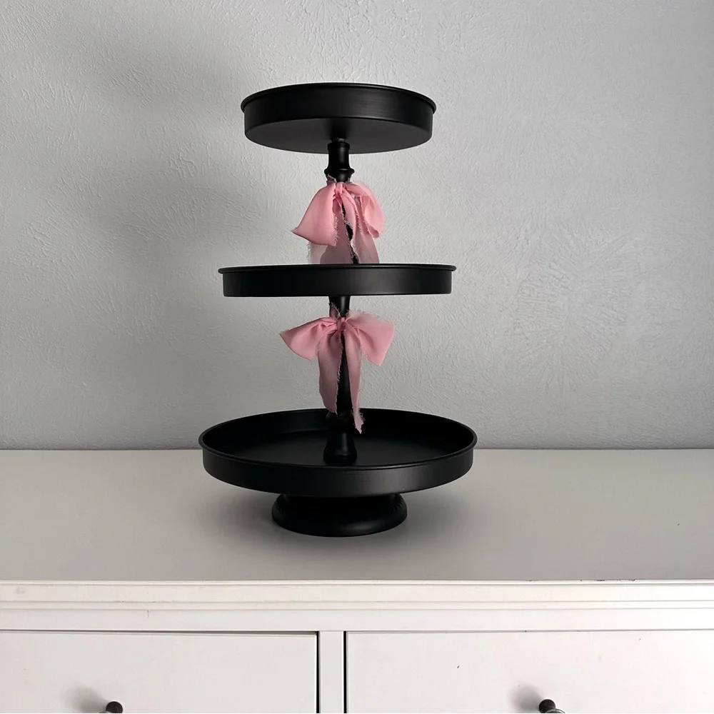 Black Three-Tiered Stand with Pink Silk Bow Accents